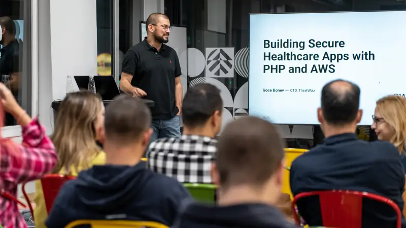 Goce Bonev presenting a talk on building secure healthcare applications with PHP and AWS